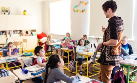 teacher and schoolkids in classroom