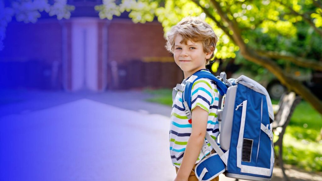 happy schoolboy with schoolbag. Estonian education system comparison. reports