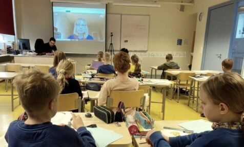 students in classroom during online lesson Estonia